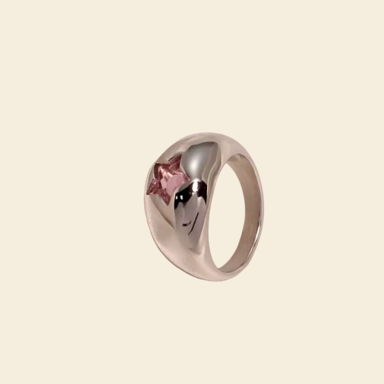 Silver ring with a heart design on a white background