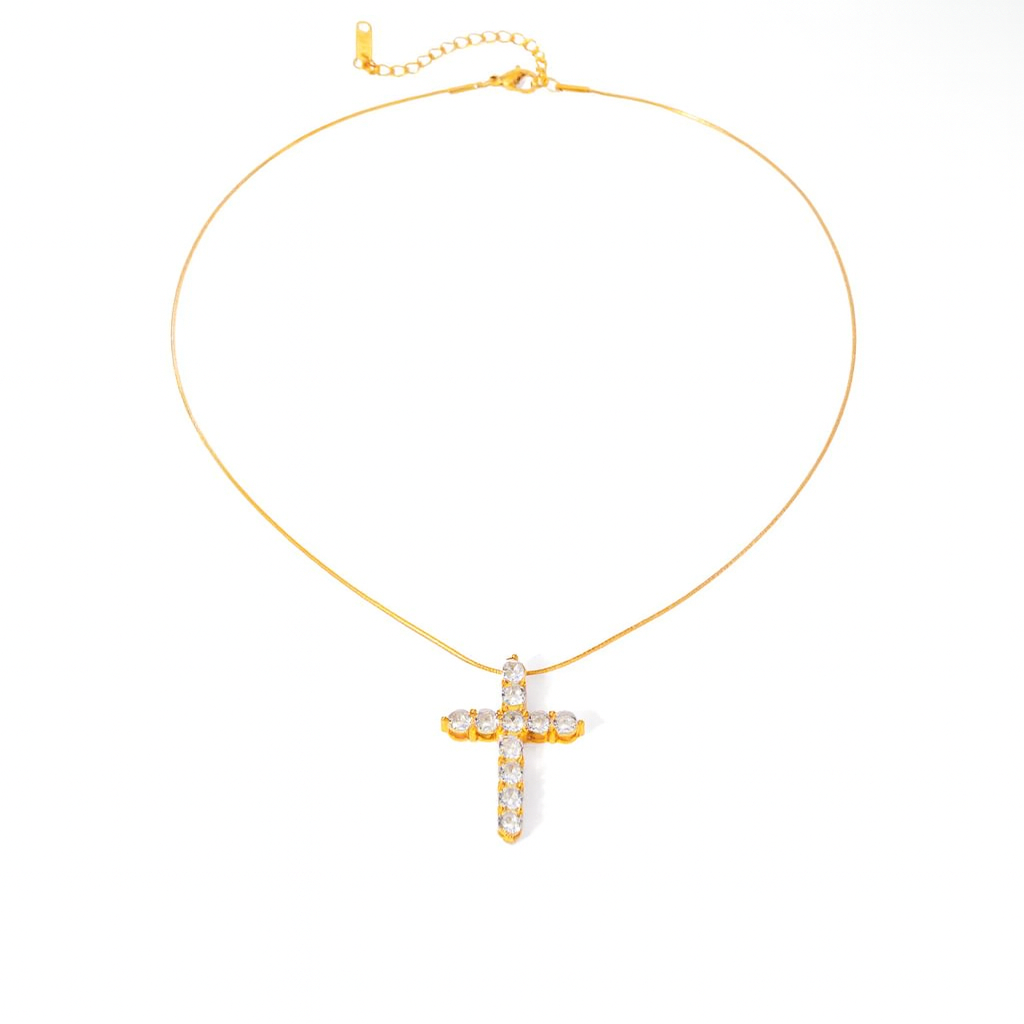 Gold necklace with a cross pendant on a white background
